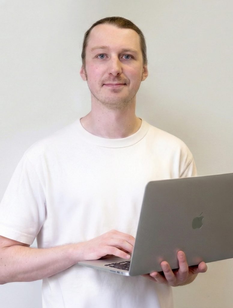 Photo of director with laptop
