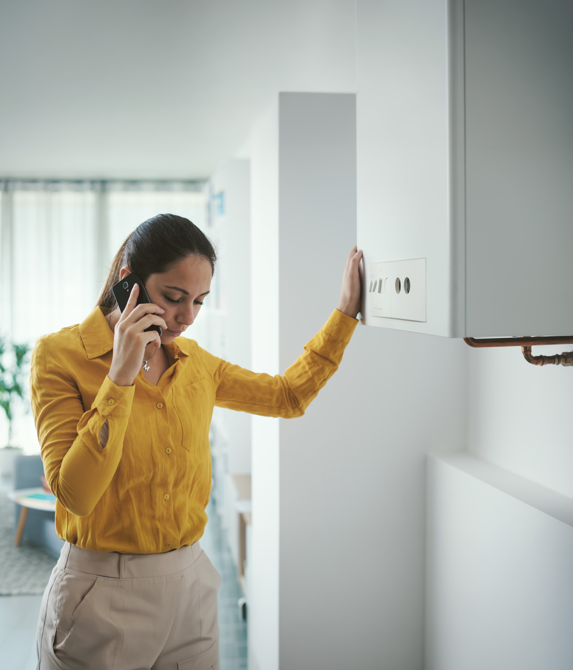 Women contacting a boiler servicing company by phone