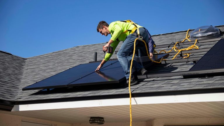 Installation of a solar panel on a house roof