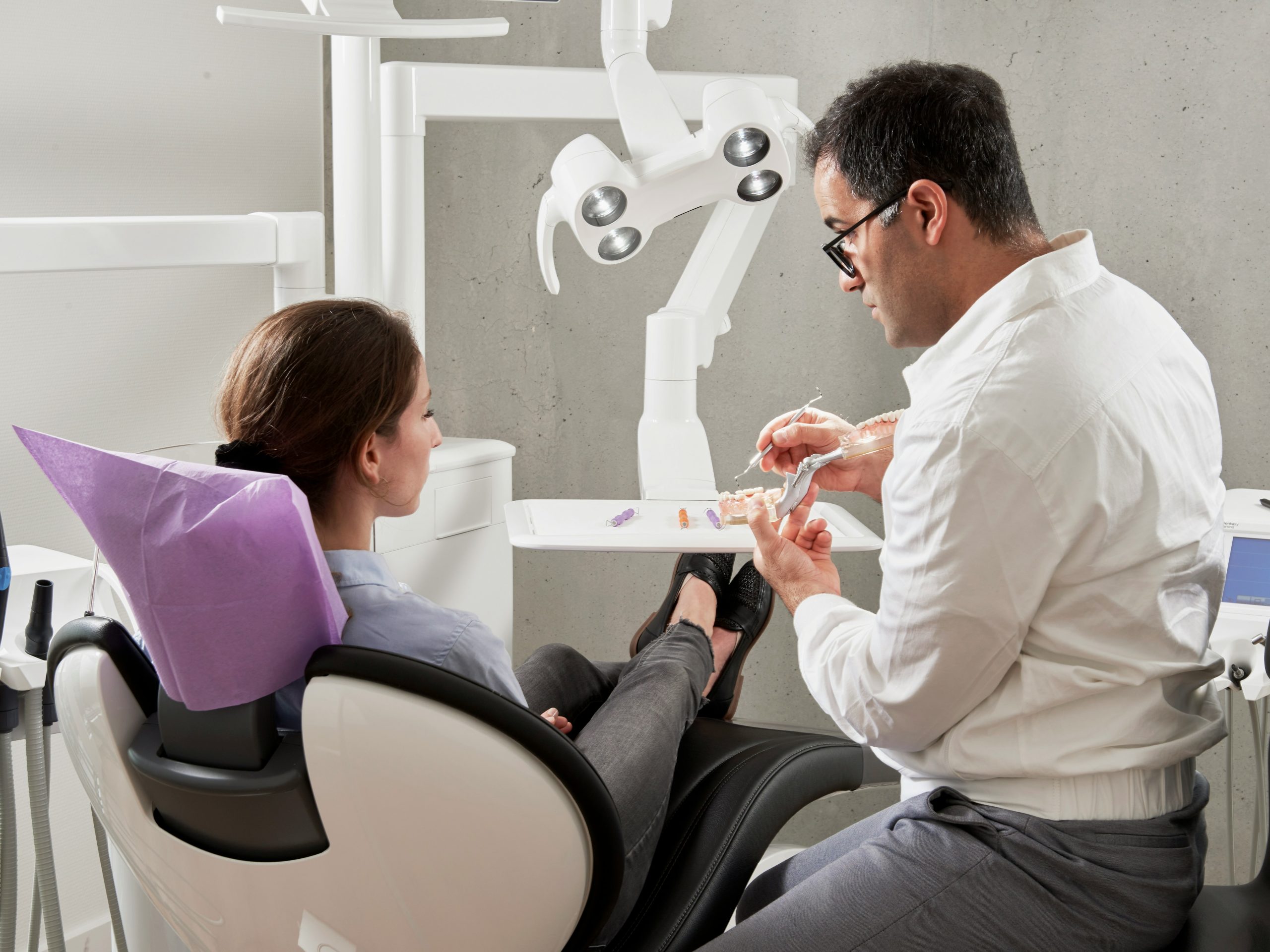 Dentist with patient in dental practice